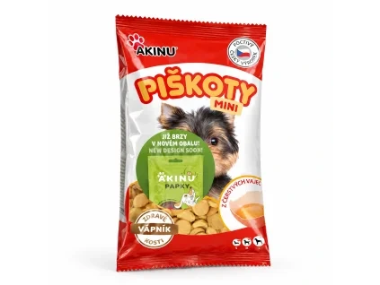 Packshot SKU 173009 (Akinu Mini piškoty s vápníkem 120 g) — sólo na bílém, náklon dle 173010. Obal: aktuální se samolepkou „Již brzy v novém obalu“ (upload b4dd53f3). 2k 1:1, v1 ze 2.