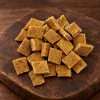 Surovina 282041 Akinu SUPRIMO SELECTION Mobility 75 g (kuřecí) – hromádka na tmavém prkénku, kategorie pamlsek psi (p3 ze 4)